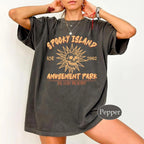 Person wearing a dark gray t-shirt with 'Spooky Island Amusement Park' graphic design.