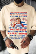 Person wearing a white t-shirt with colorful text and graphics, including a graphic of a person holding a flag.