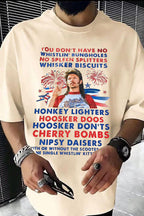 Person wearing a white t-shirt with colorful text and graphics, including a graphic of a person holding a flag.