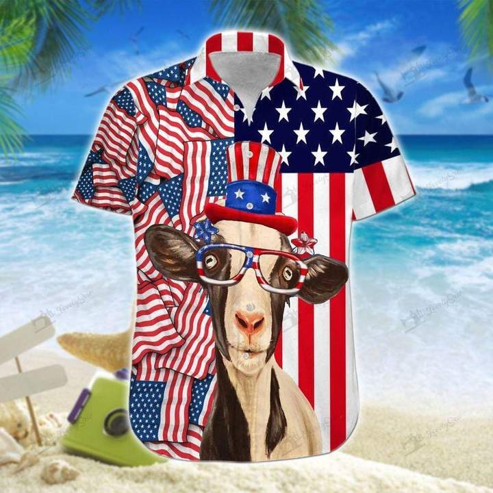 A colorful Hawaiian shirt featuring a patriotic design with an image of a goat wearing sunglasses and a shirt with stars and stripes patterns. The background has a beach and palm tree motif.